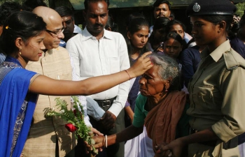 A senior citizen being welcomed